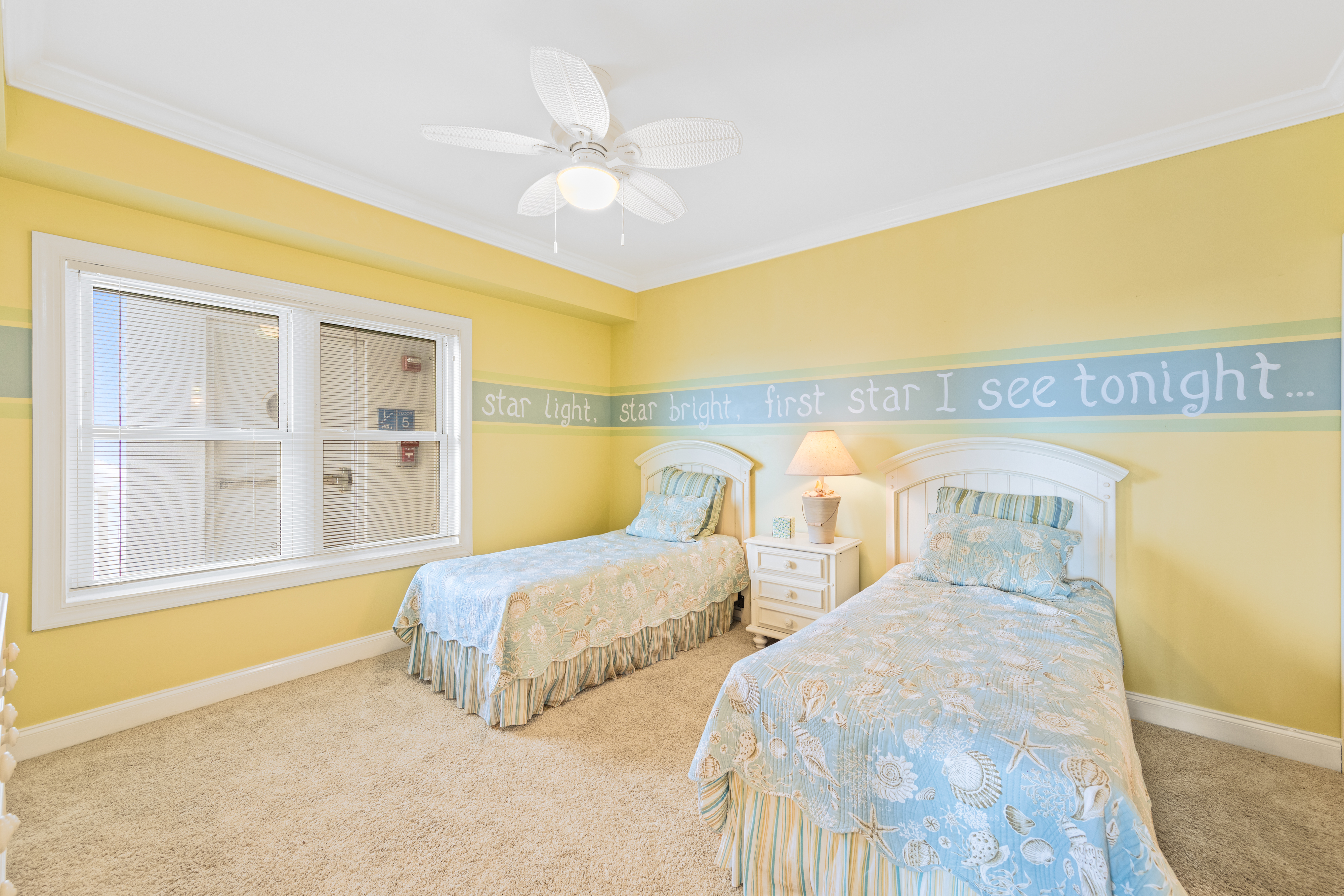 Bedroom 2 features 2 twin size beds.