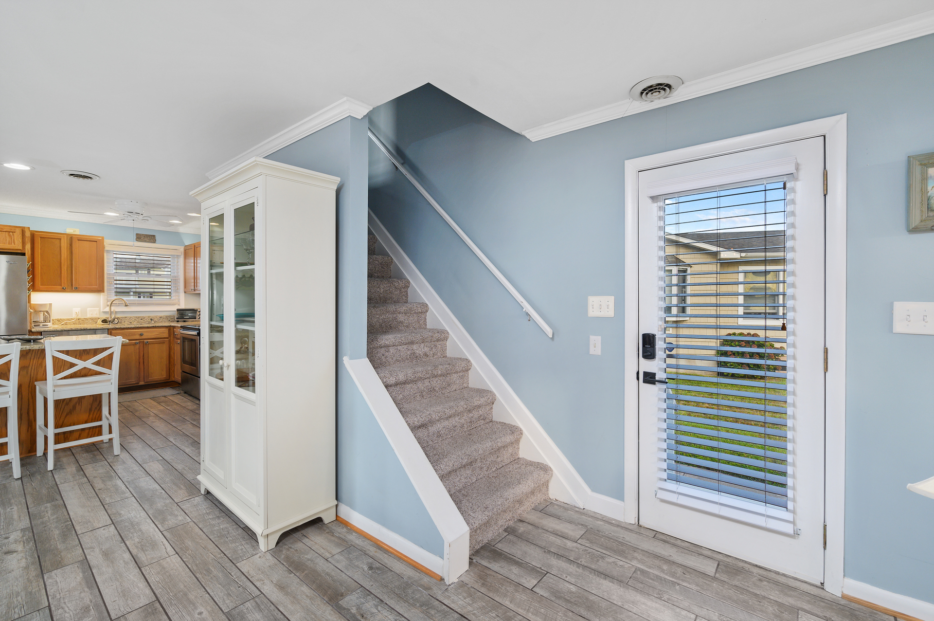 Gorgeous floors reminiscent of the ocean driftwood lead you to the upstairs.
