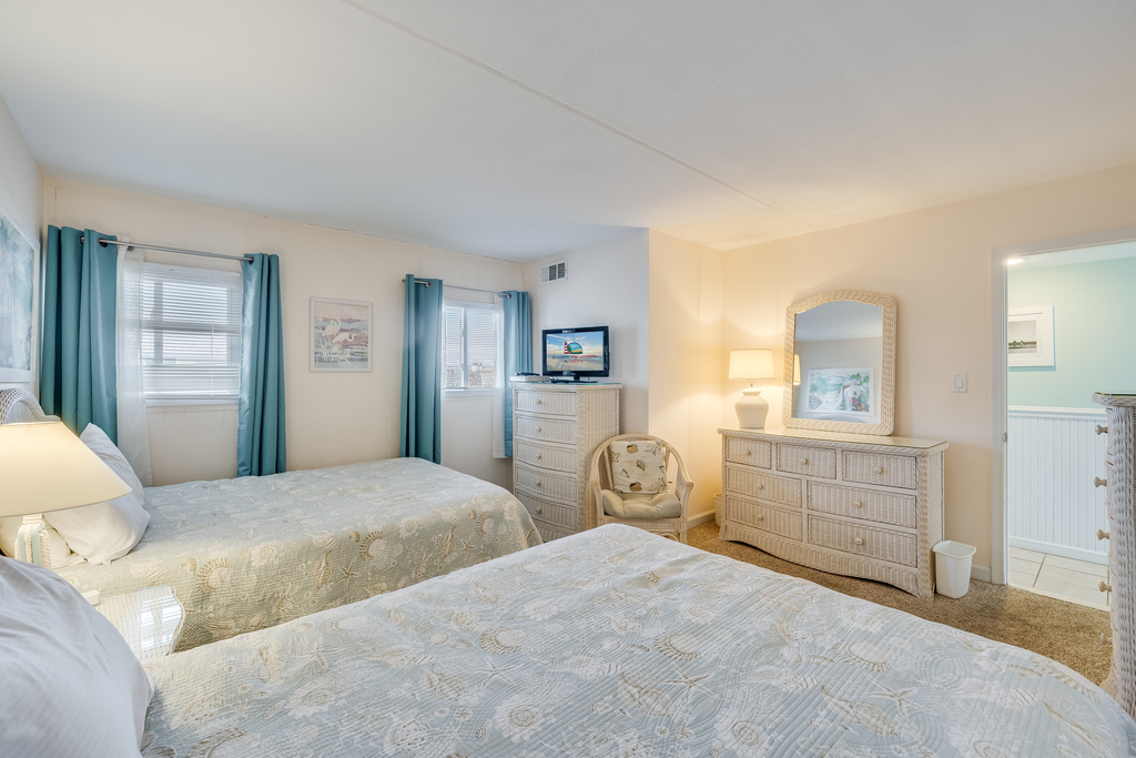 Sink into the bed and enjoy the Flat Screen TV.