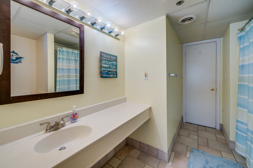 Wash away the sand from your beach day in the shower/tub combo.