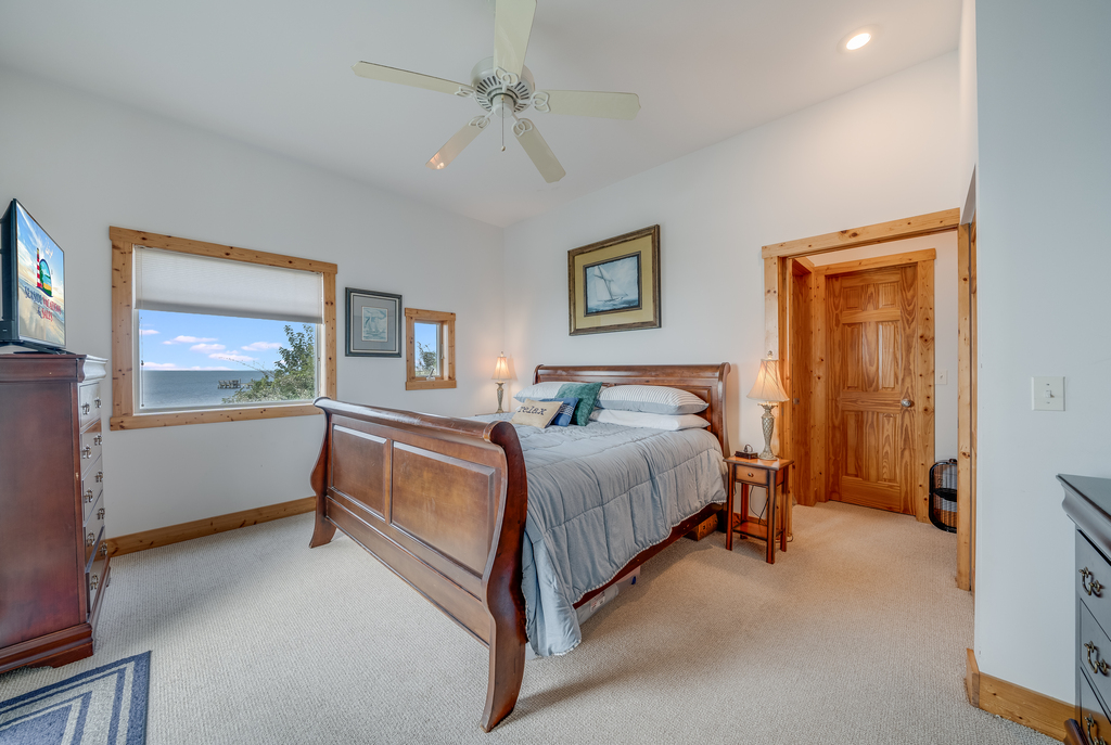 Bedroom 1 is on the 1st Floor and has a luxurious King Bed, Private Bayfront Balcony, and En-Suite Full Bath! and warm