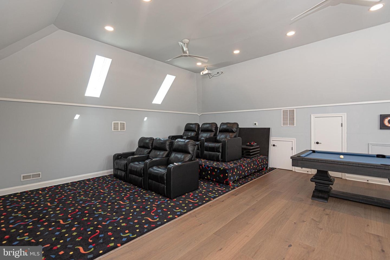This Room offers a Jumbo Flat Screen TV, Theater Style Seating for 6, and a Pool/Ping Pong Table!