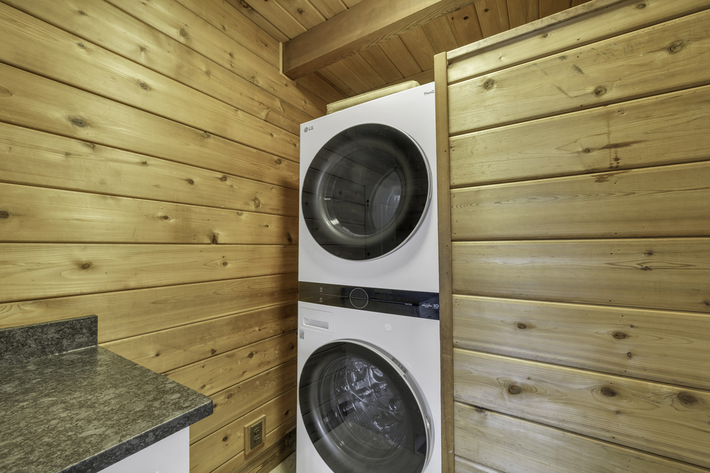 Brand New Stackable Washer and Dryer just off the Kitchen.