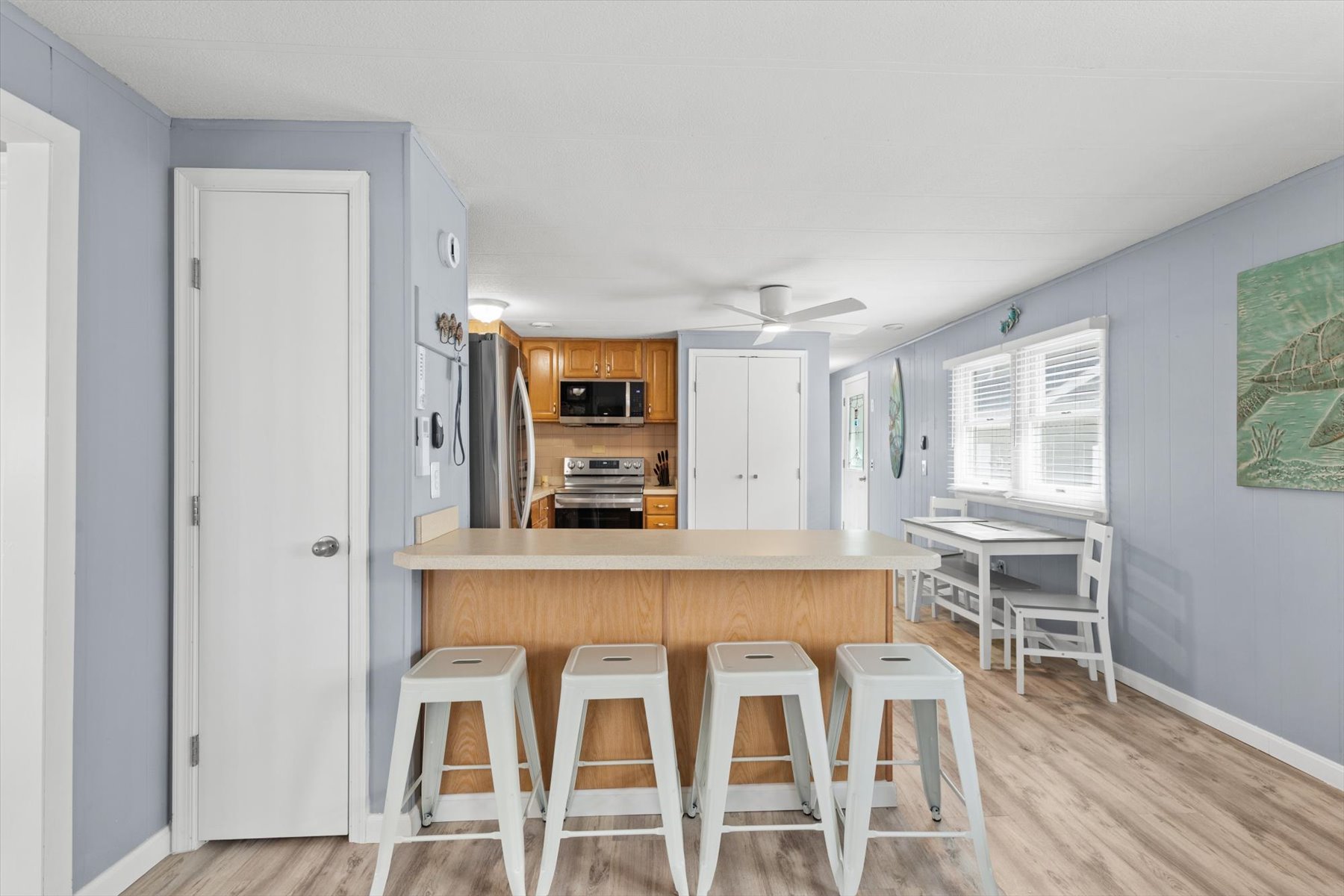 Located just off the kitchen is also a full size washer and dryer for your convenience.