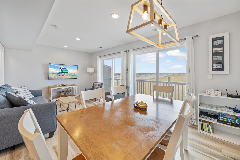 Enjoy family meals at the spacious Dining Area in the comfort of AC, or down on the Dock!