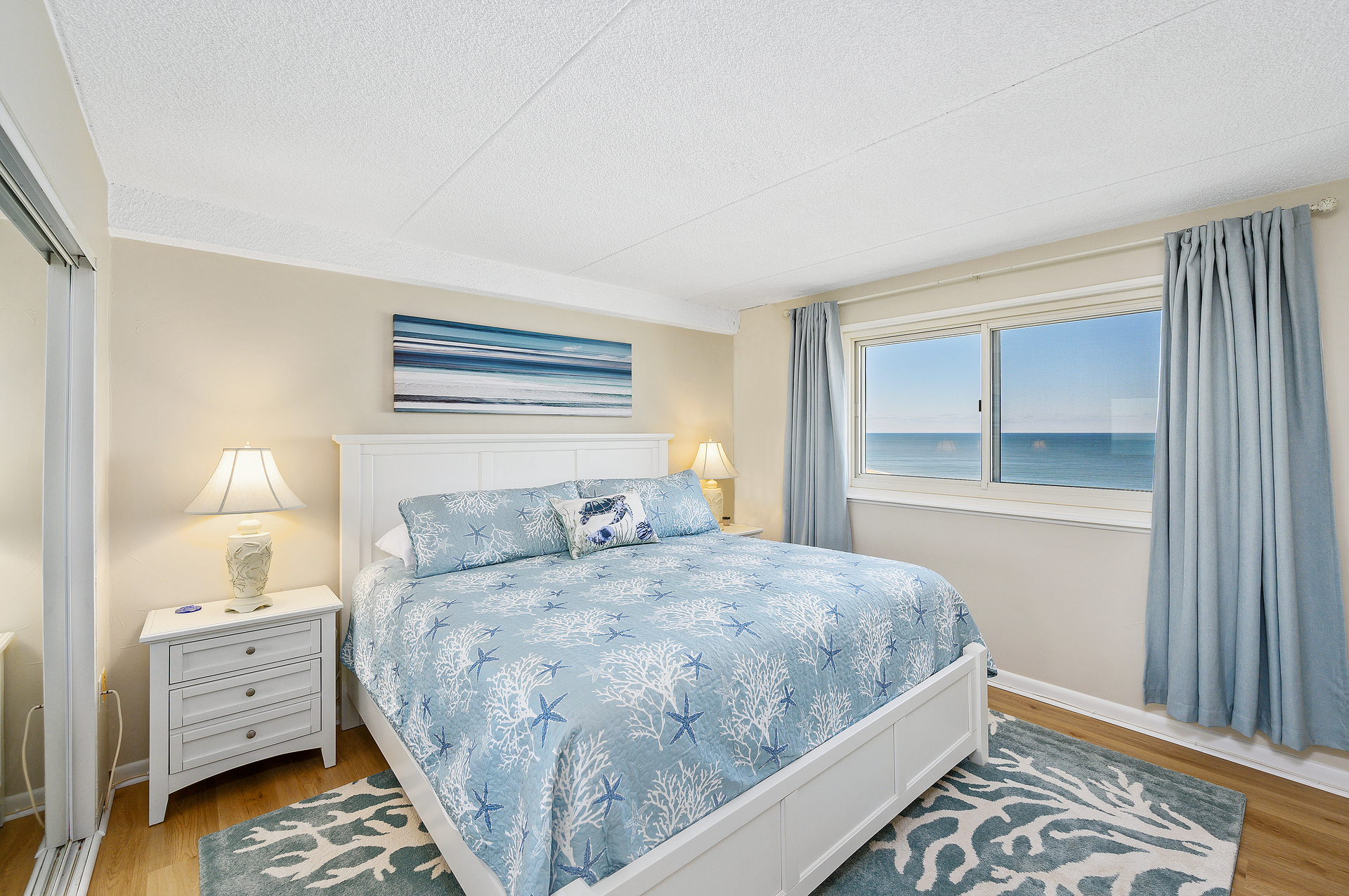 The Primary Bedroom is Pure Bliss with a Plush King Bed, attached Bath and Ocean Views!