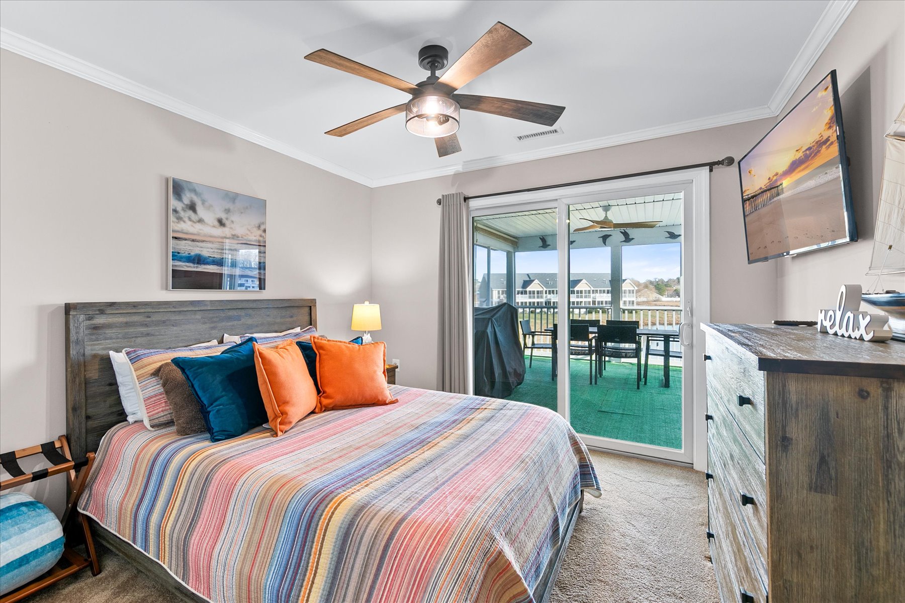 Bedroom 2 has a cozy Queen Bed, Streaming TV and Balcony access