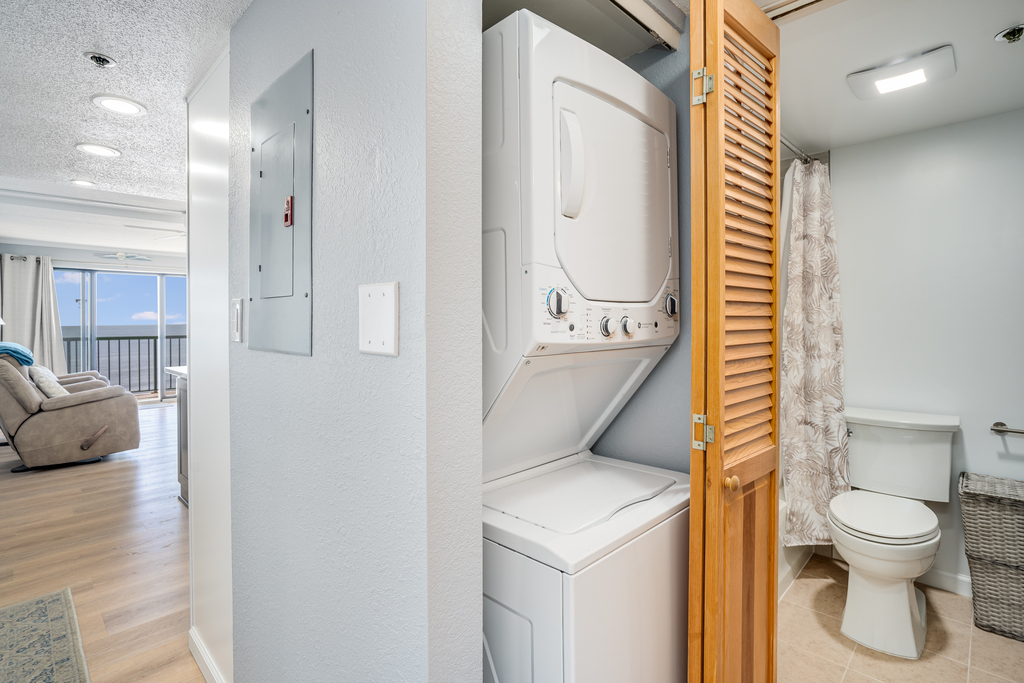Tucked in the hall is the Stacked Washer/Dryer - a perfect convenience.