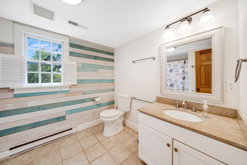Full Bath 2 is dressed in beachy blues, and is on the 2nd floor.
