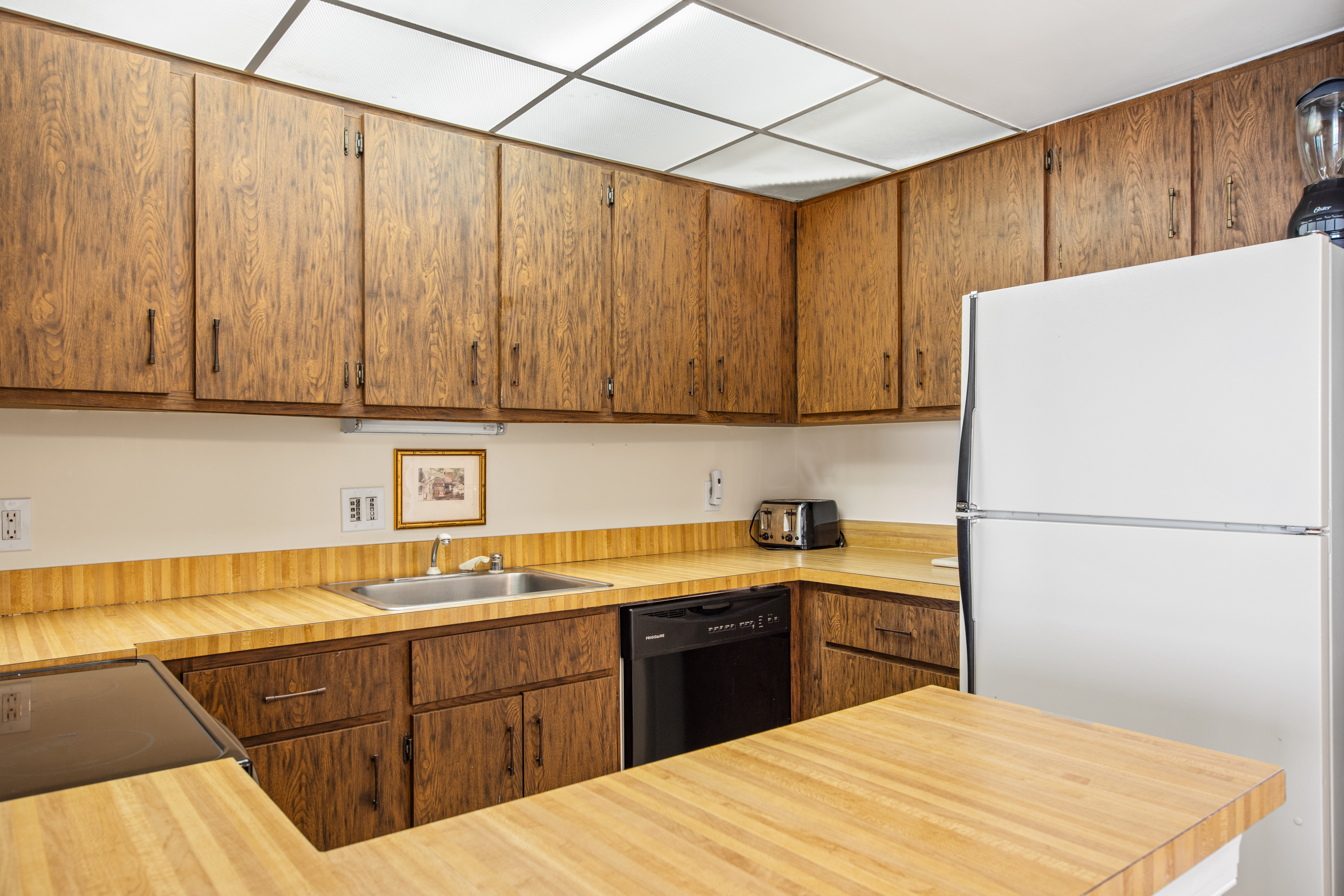This kitchen features natural wood cabinets - retro vibes!