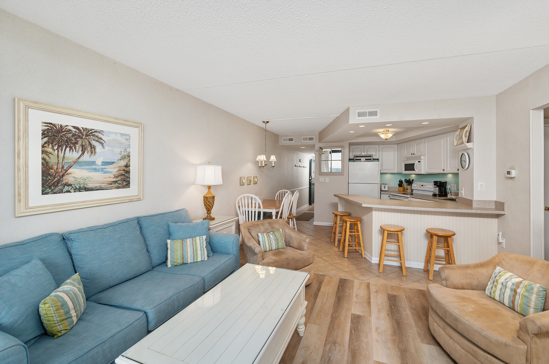 Adorned in Colors of Sands & Sea with Flooring reminiscent of Driftwood.