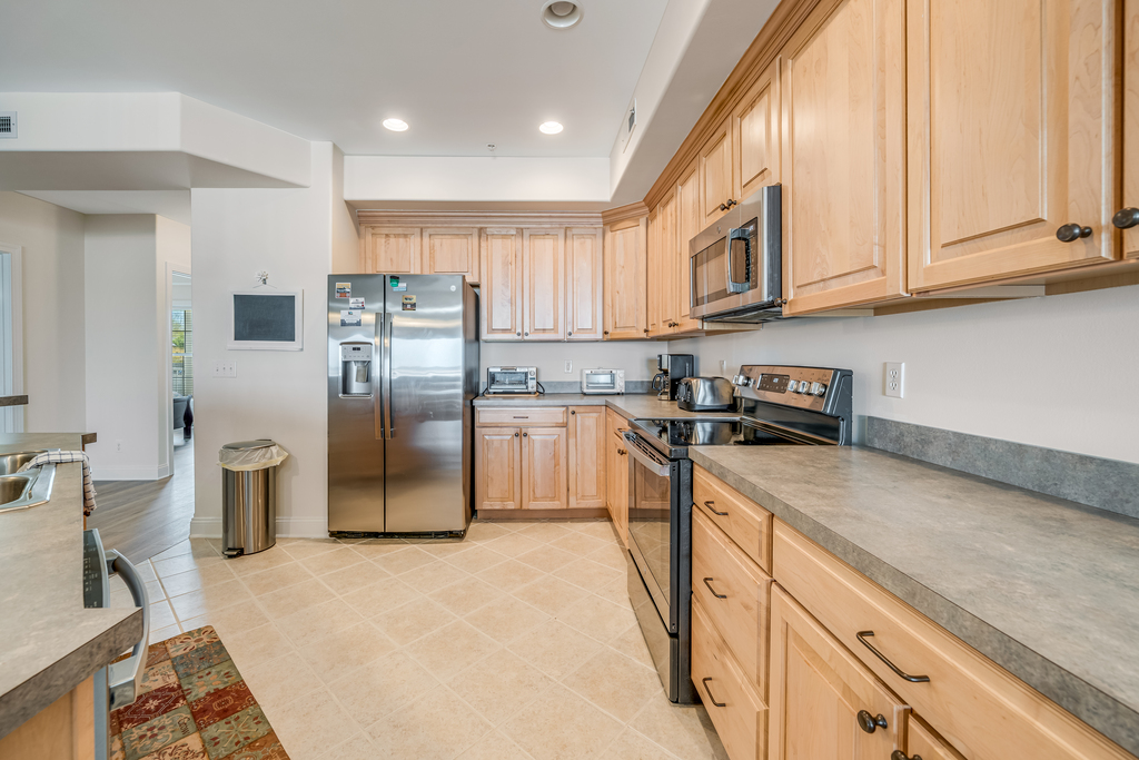 Stainless Appliances and Tile Flooring.