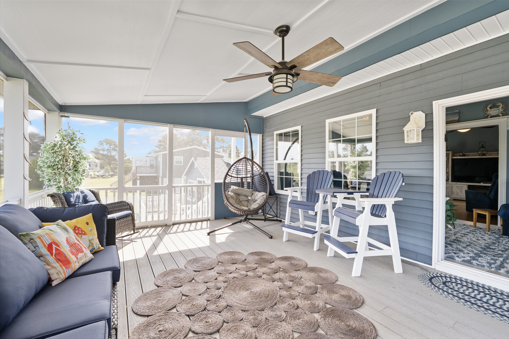 Screened Porch with lots of fun and comfy seating.