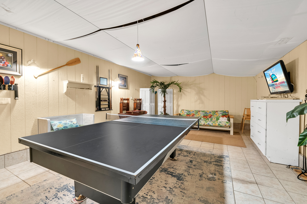 Check out this Game Room with Pool, Ping Pong, and more!