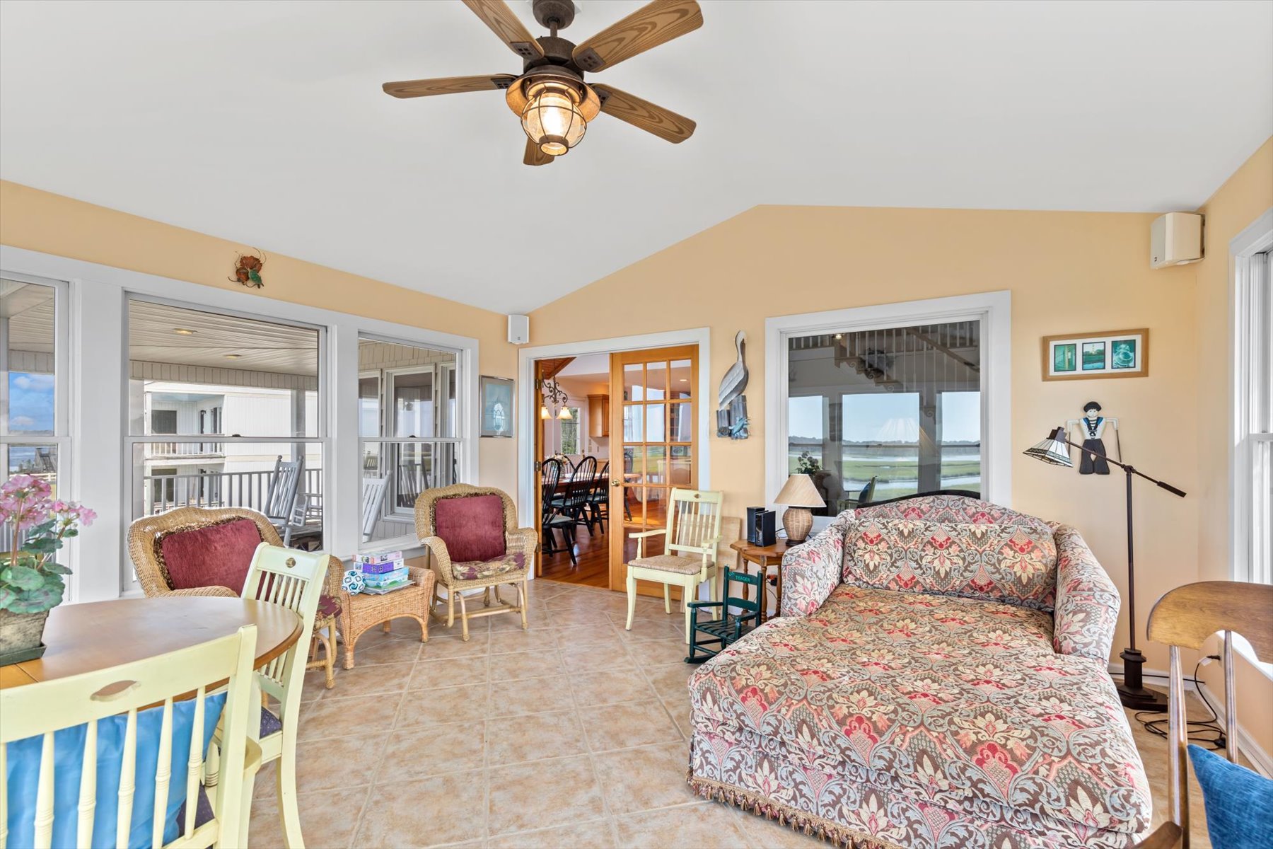 A beautiful Sunroom, just off the Living Area, directly overlooks the water.