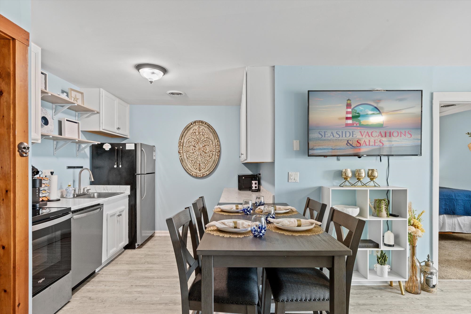 This functional kitchen comes complete with a full-sized refrigerator, stove, and convenient countertop space for meal prep.