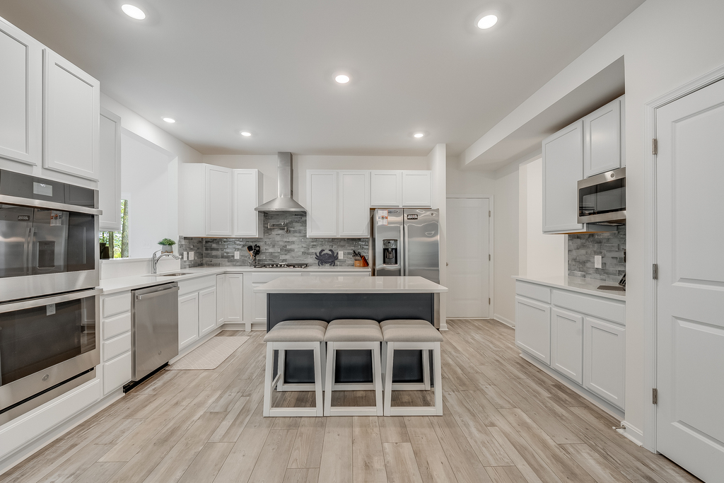 Beachy White Cabinetry and all the bells and whistles.