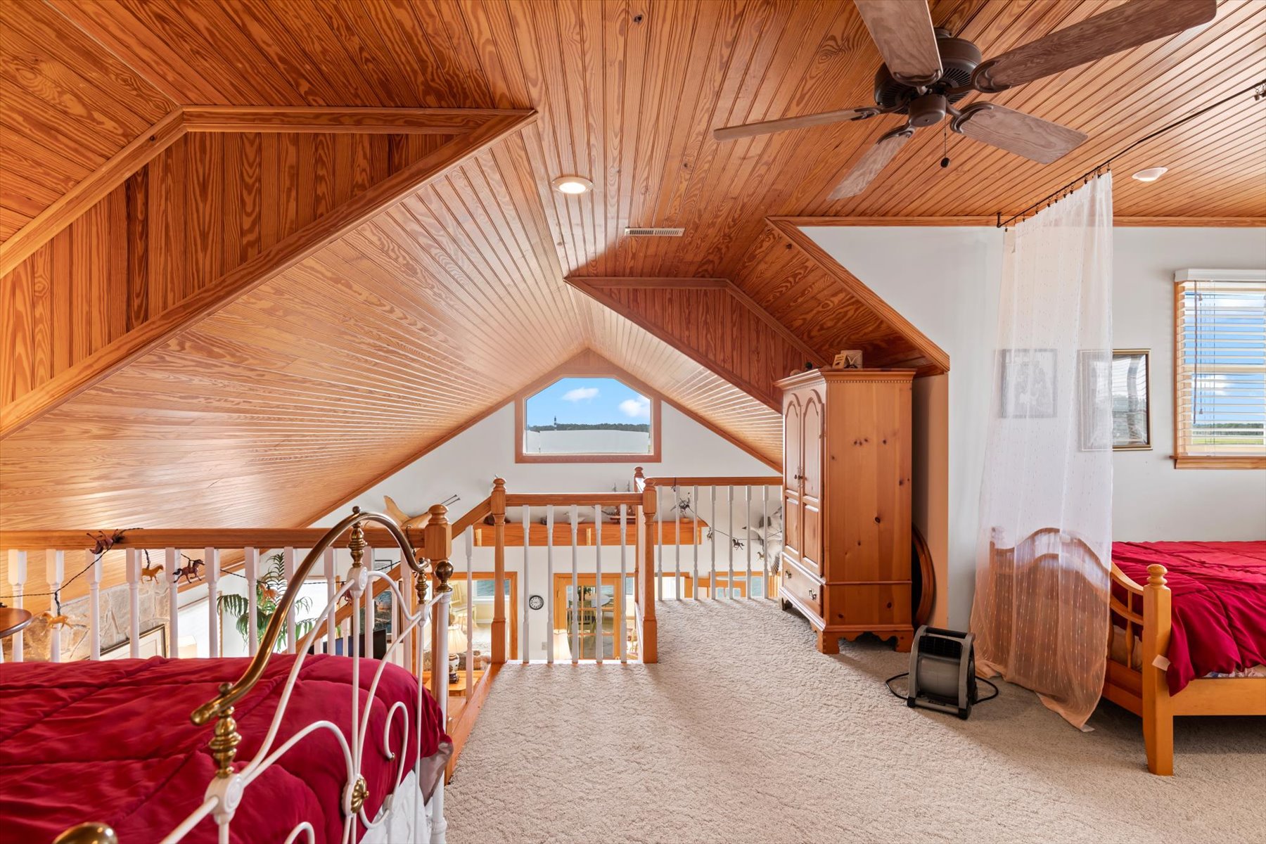 The Loft Bedroom overlooks the Living Area.