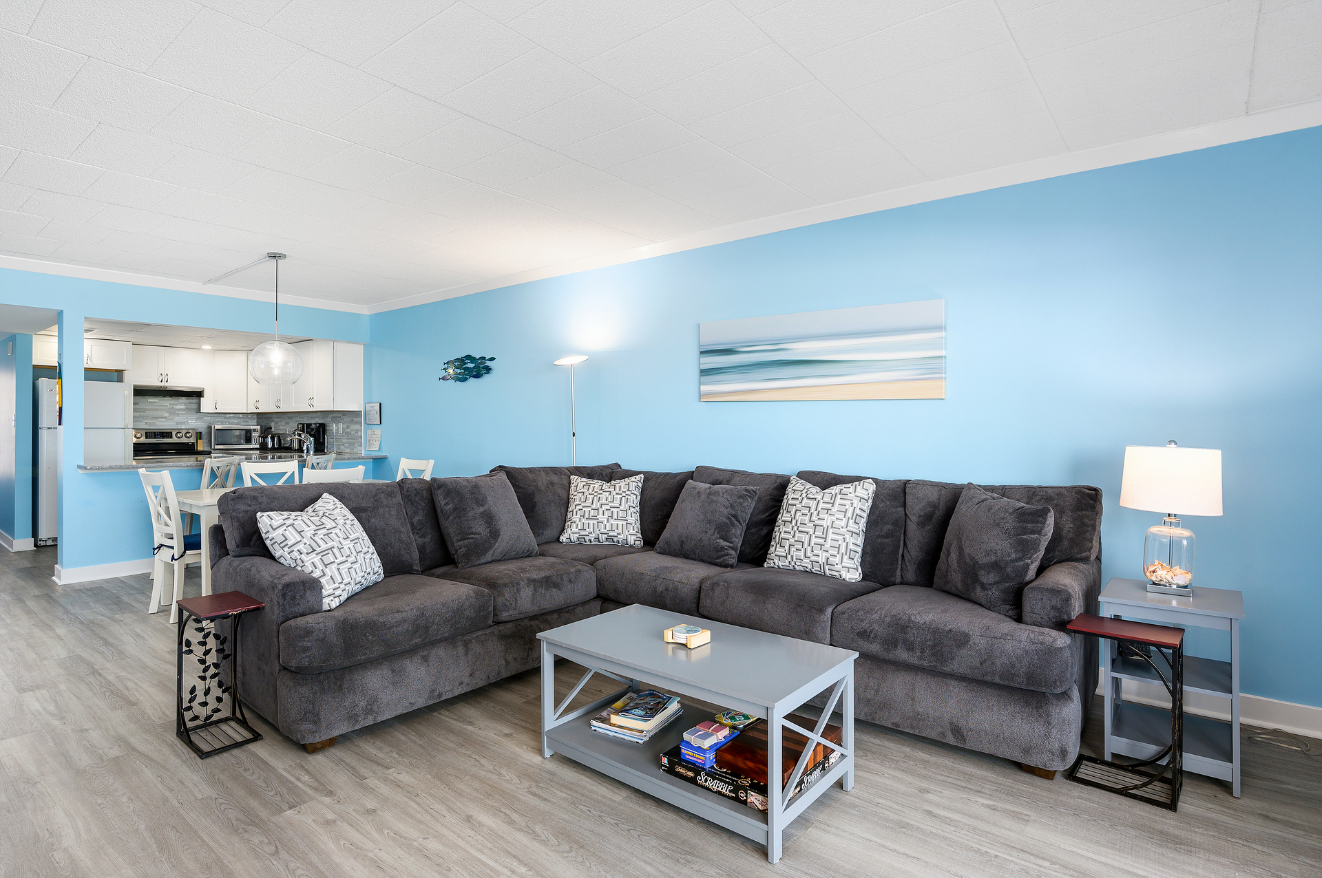 The new furniture in the living room will welcome you right in to relax in the AC after a fun day at the beach