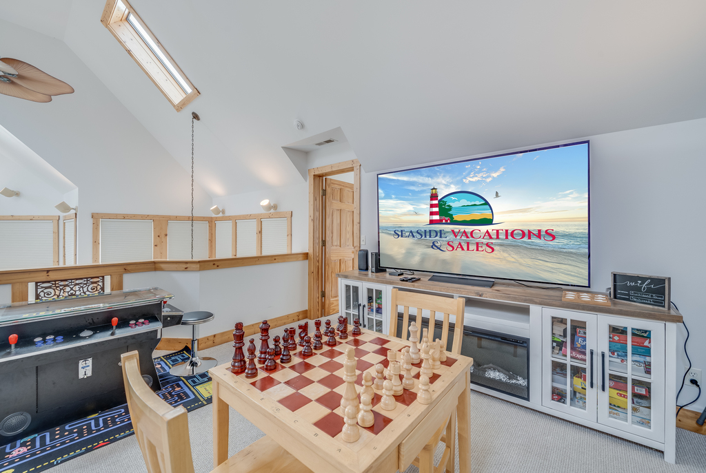 Wandering upstairs, you'll find an awesome Loft with Video Games, Board/Table Games, and Flat Screen TV!