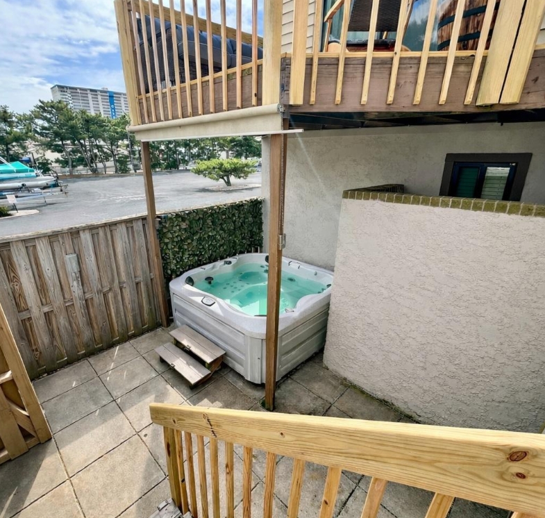 Unwind and soak your cares away in your own private, covered hot tub located just off the lower patio area.