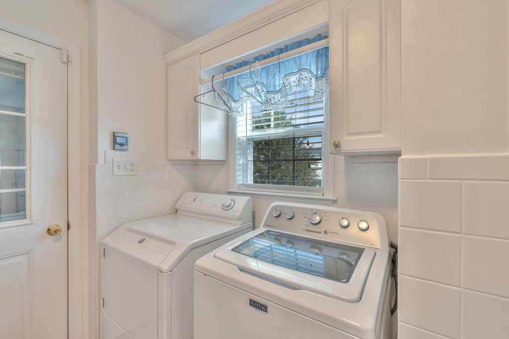 The home is equipped with a full size Washer & Dryer just off the Kitchen Area.