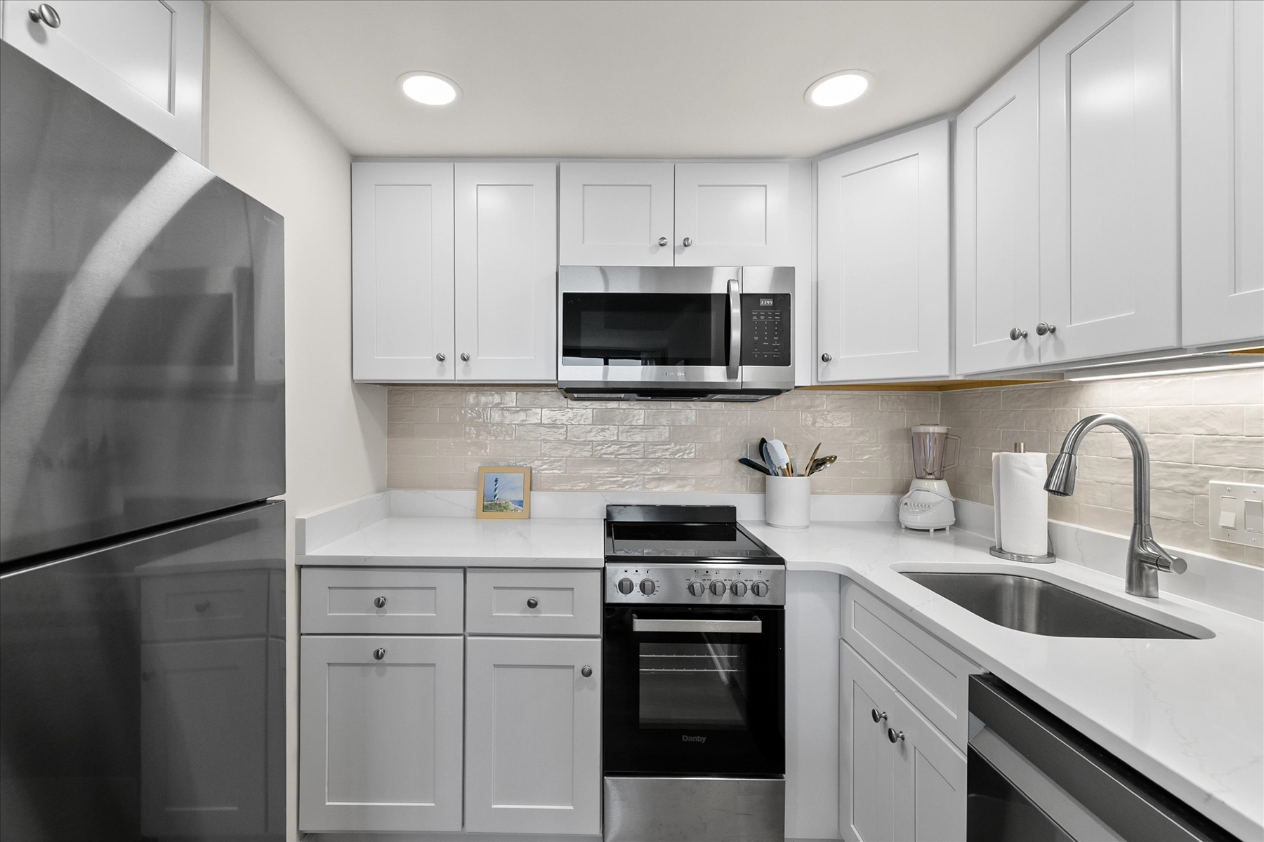 A complete view of the bright, modern kitchen equipped for all your culinary needs.