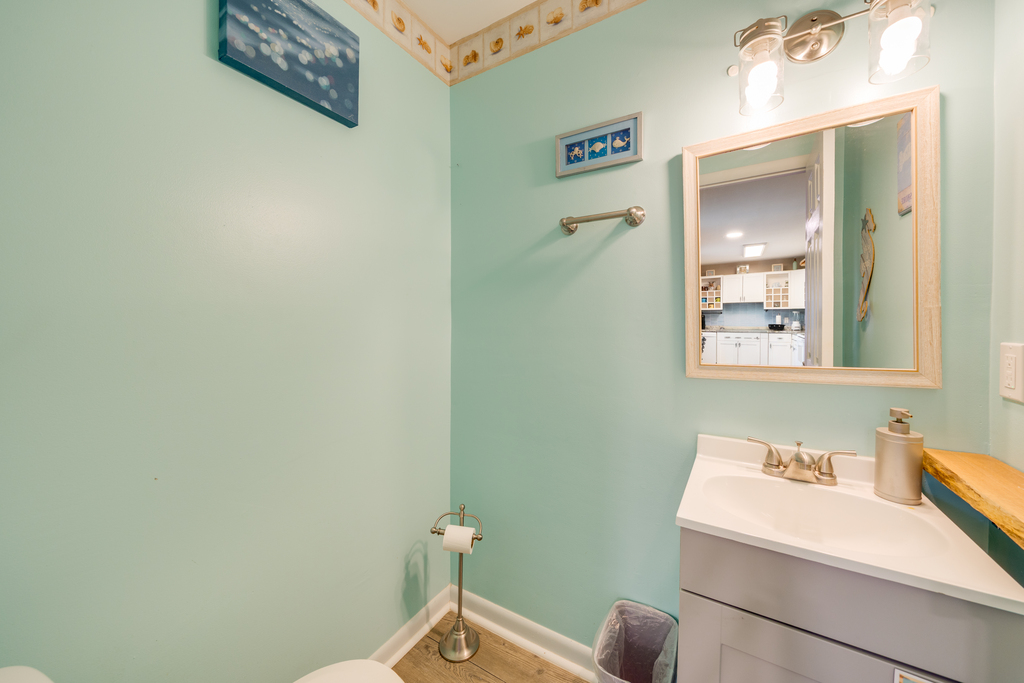 Convenient Half Bath just off Kitchen and Living Area.