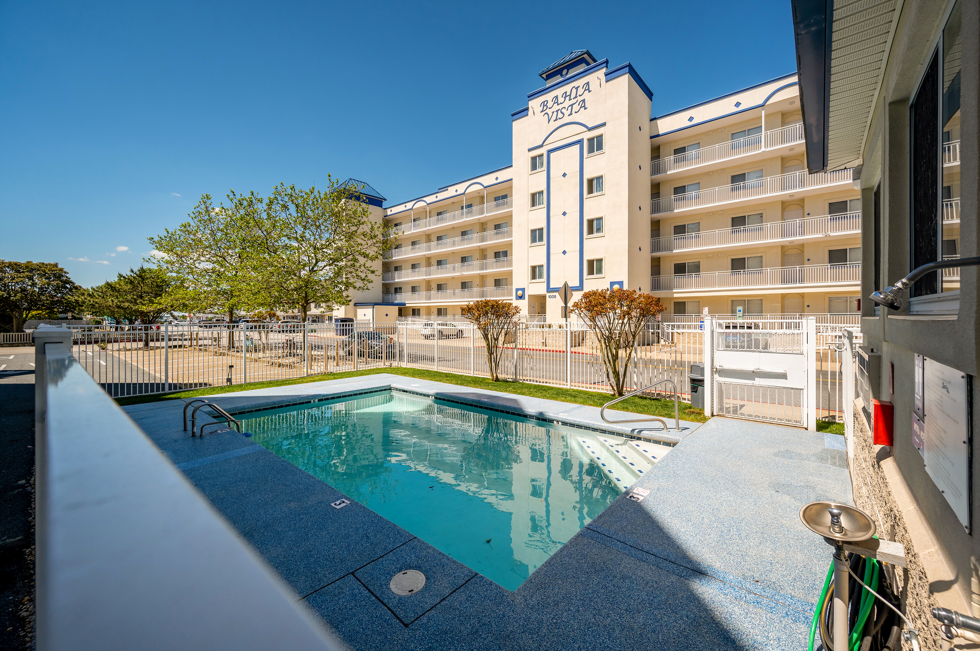 The Seasonal Outdoor Community Pool is located directly across the street, on the ground level of the East Building