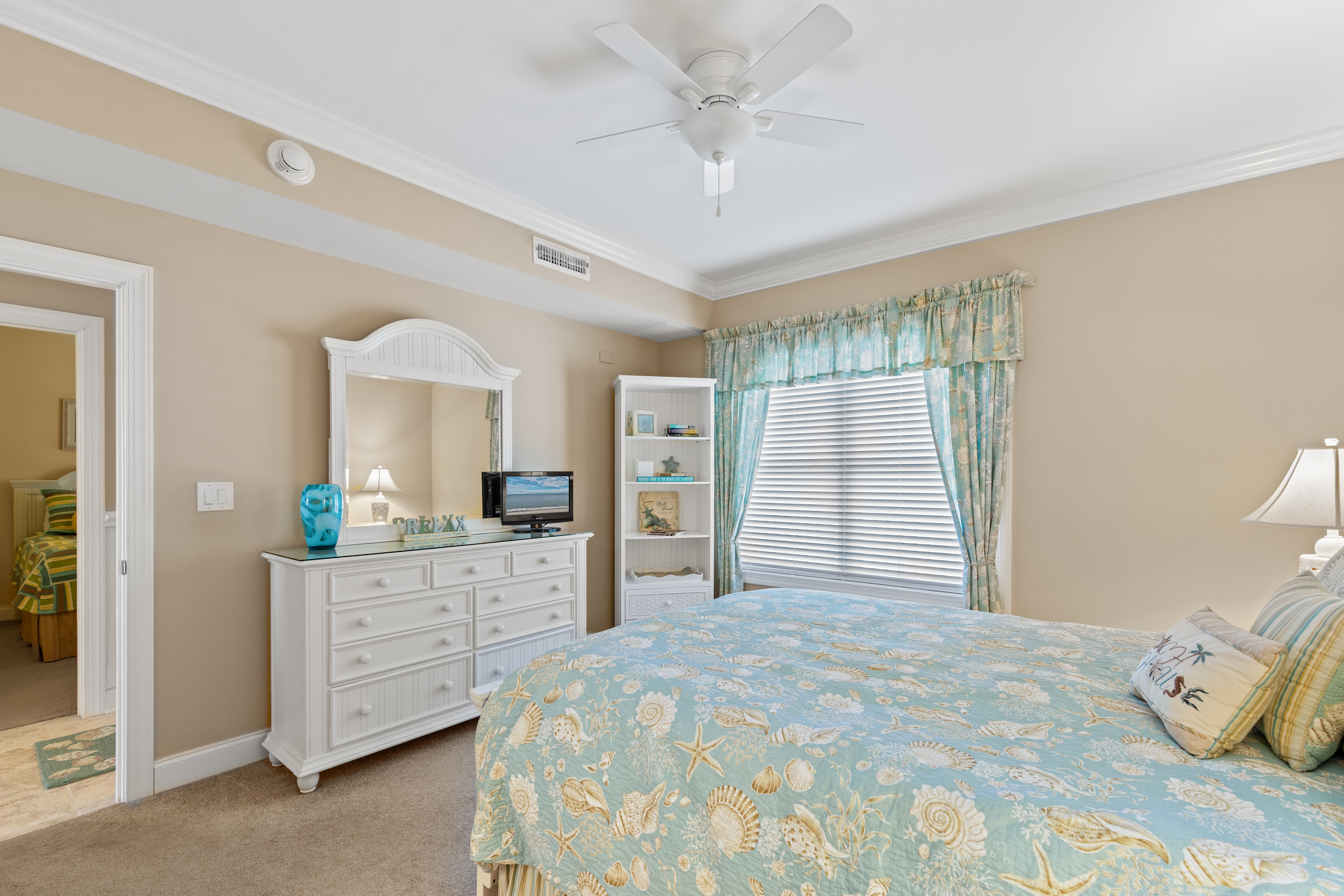 After a long day on the beach, unwind in the comfy bed with your favorite show.