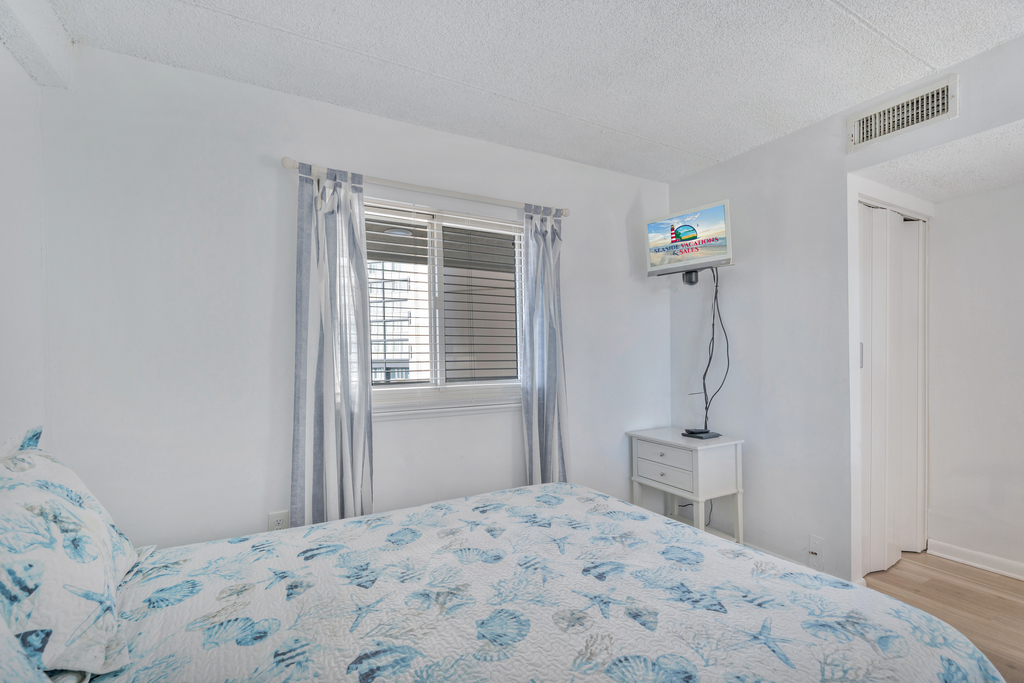 Adorned in Coastal hues, and offering a Flat Screen TV.