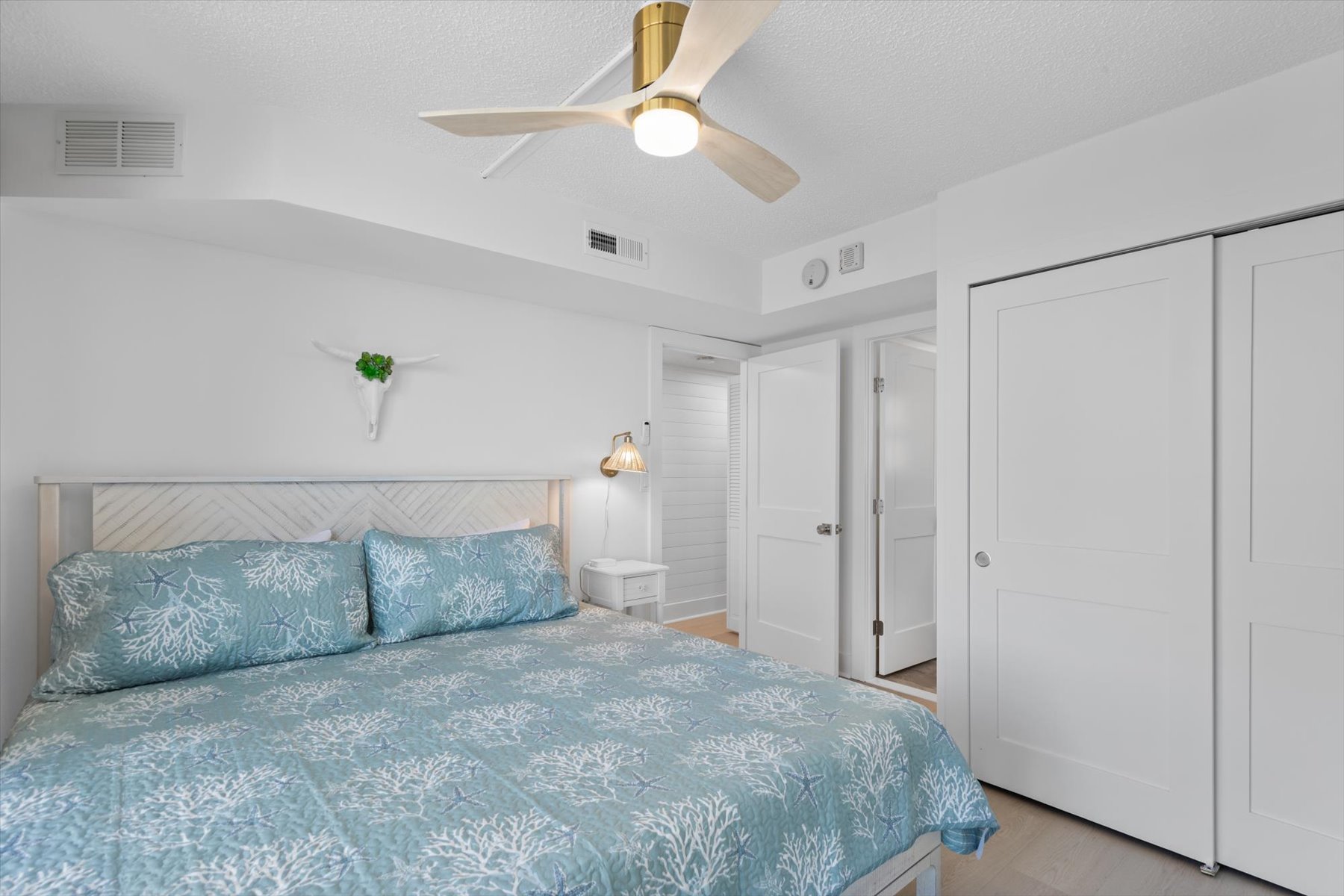 Clean and calm costal bedroom.
