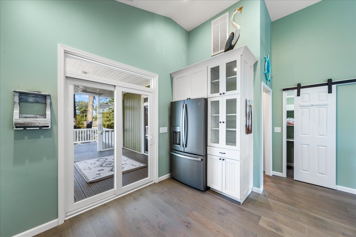 Just off the Kitchen is the Screened Porch.