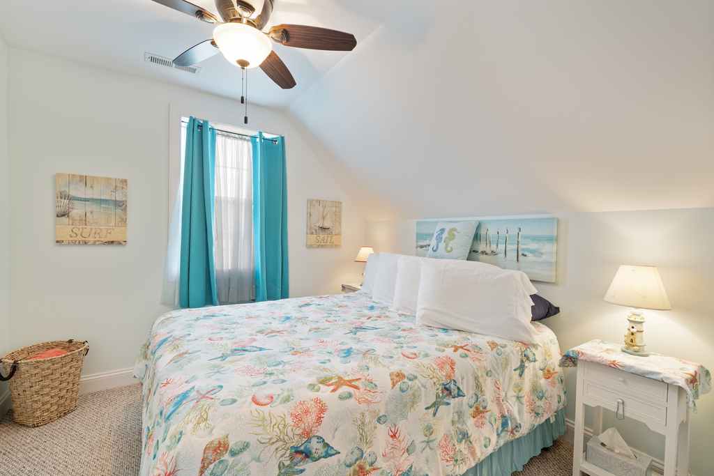 Bright and beachy Bedroom 4 also has a Queen Bed.