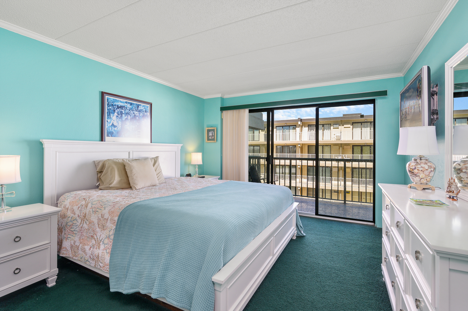The Primary Suite is a wonderful retreat with a King Bed and Balcony access.