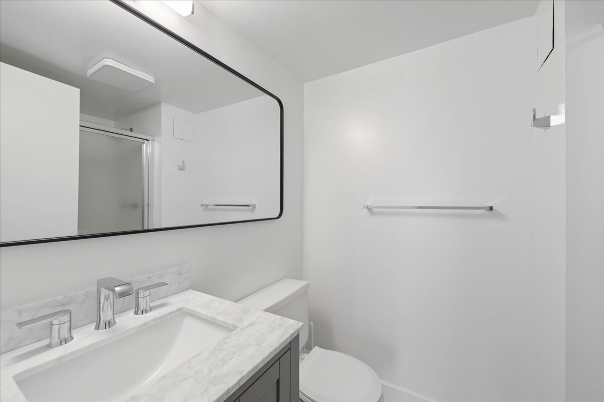 Convenient, Full Shared Bath with a Walk-In Shower.