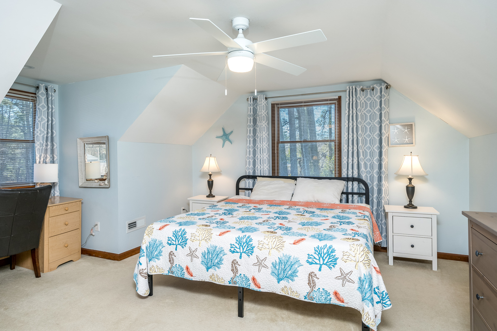 Bedroom 2 is light and bright with a King Bed.