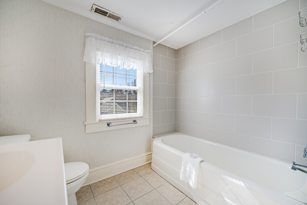 A Shared Full Bath is upstairs, and has a Tub/Shower Combo.