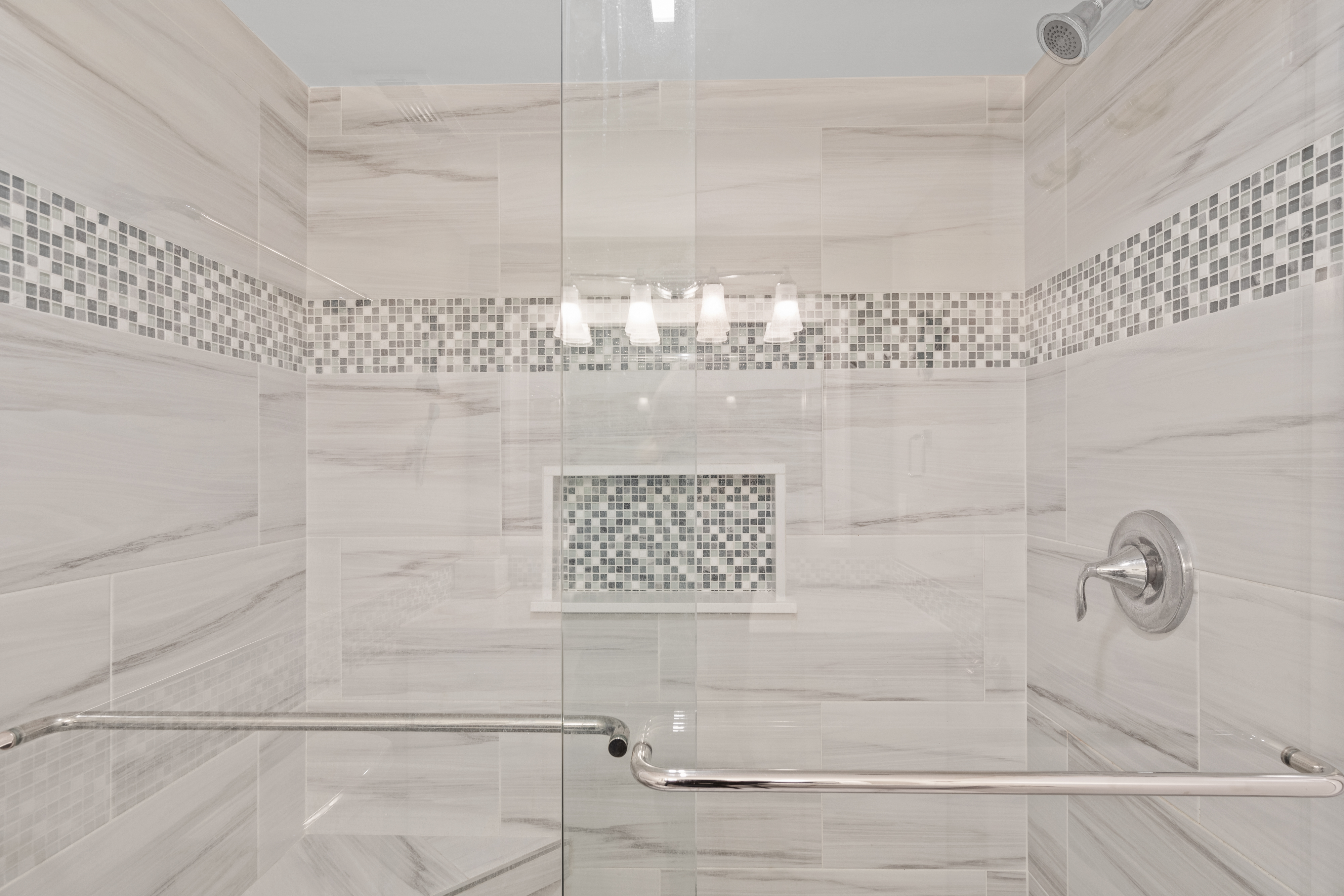 The Attached Bath is sure to please with a stunning custom tile Walk-In-Shower
