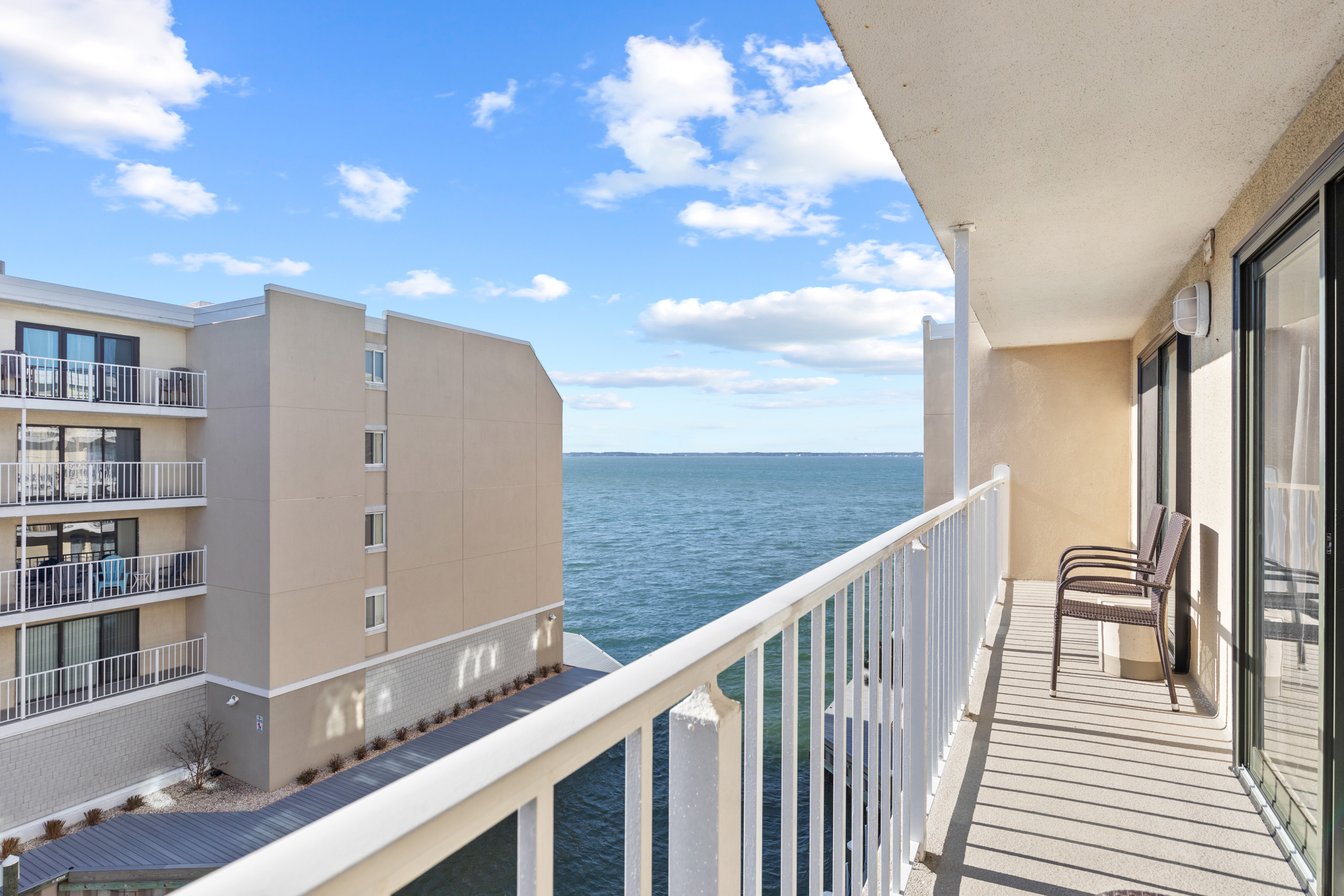 Slip out to the Balcony where you can take in views of the Bay - and the Beach is only a short stroll away.