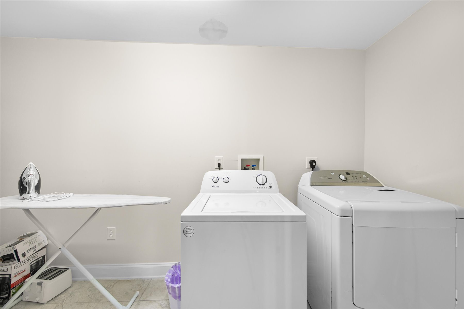 Laundry room with a washer and dryer for your convenience.