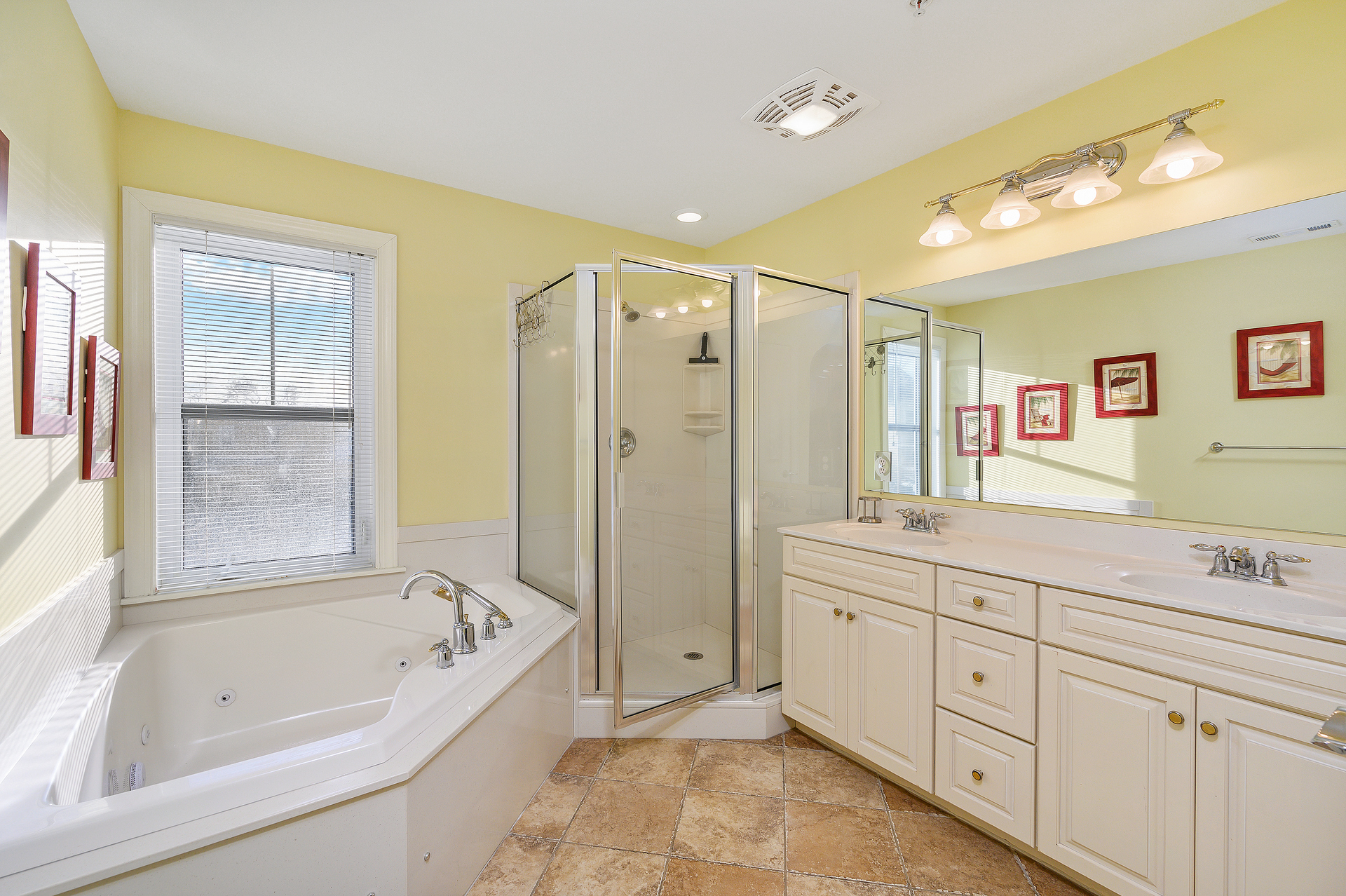 The Primary Bathroom is also home to the large walk-in shower and double vanity sink