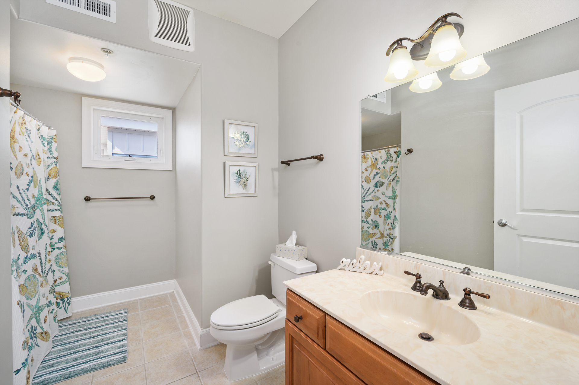 Shared Full Bath in Hall.