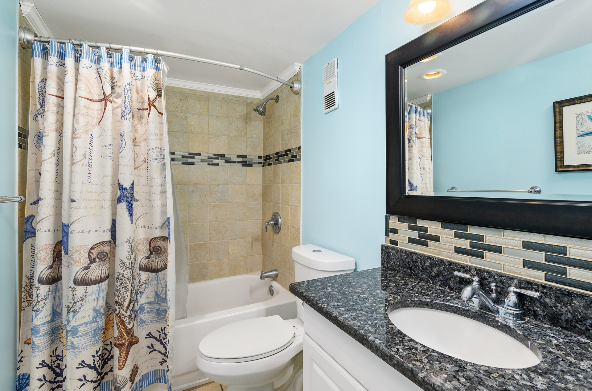 Full bathroom with a shower/tub combo.