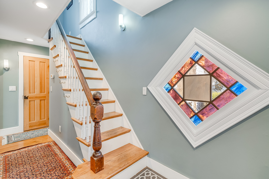 You'll be welcomed by this stunning Stained Glass Window in the spacious Foyer.