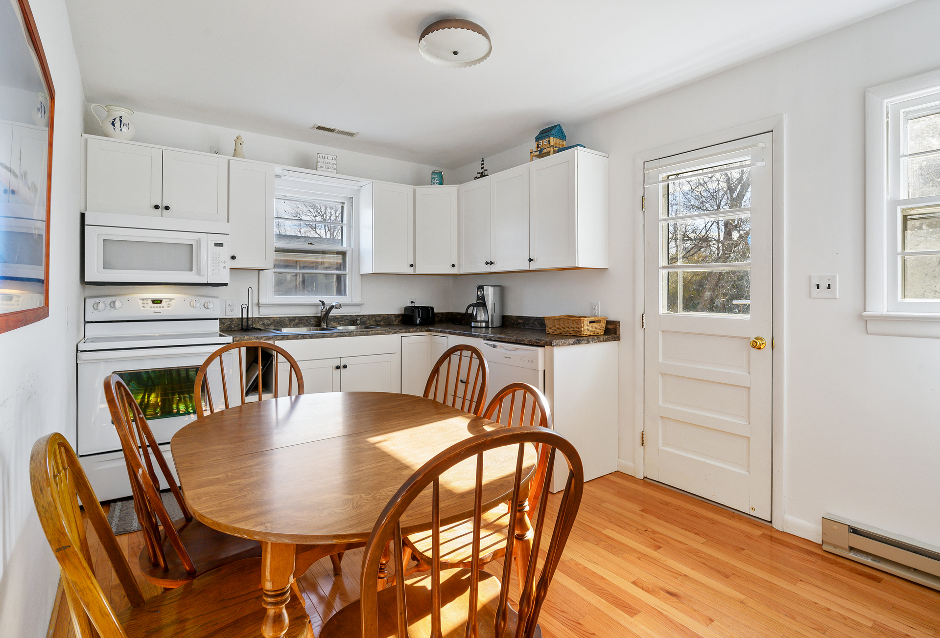 Big Kitchen Updates including Beachy White Cabinetry and New Flooring!