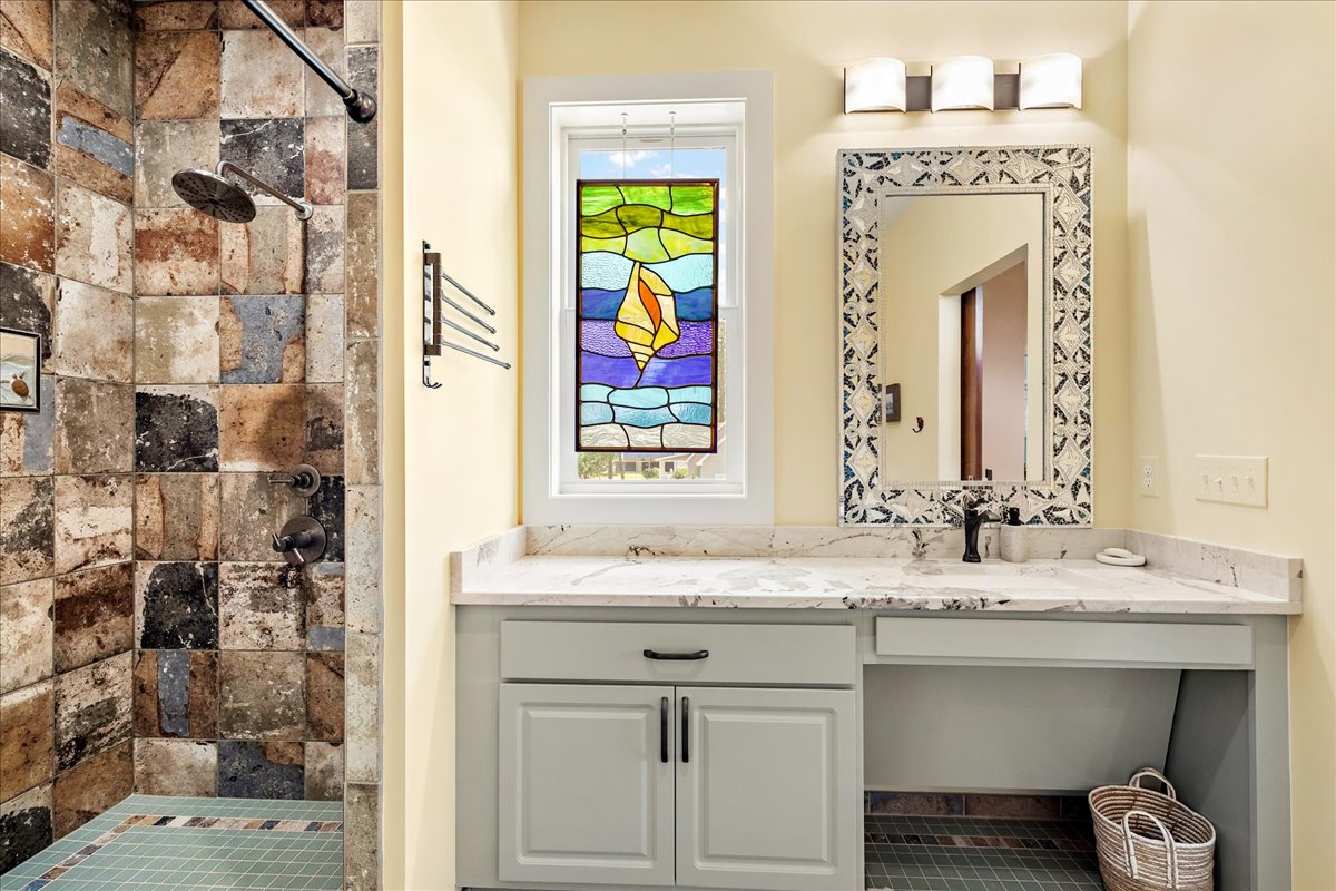 Private Master Bath 1 with beautiful Stained Glass Accents.