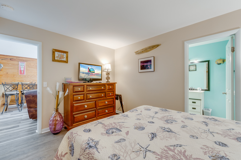 Flat Screen Smart TV and Attached Primary Full Bath.