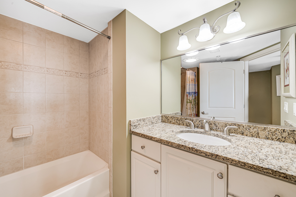 Shared full bathroom with shower/tub combo!