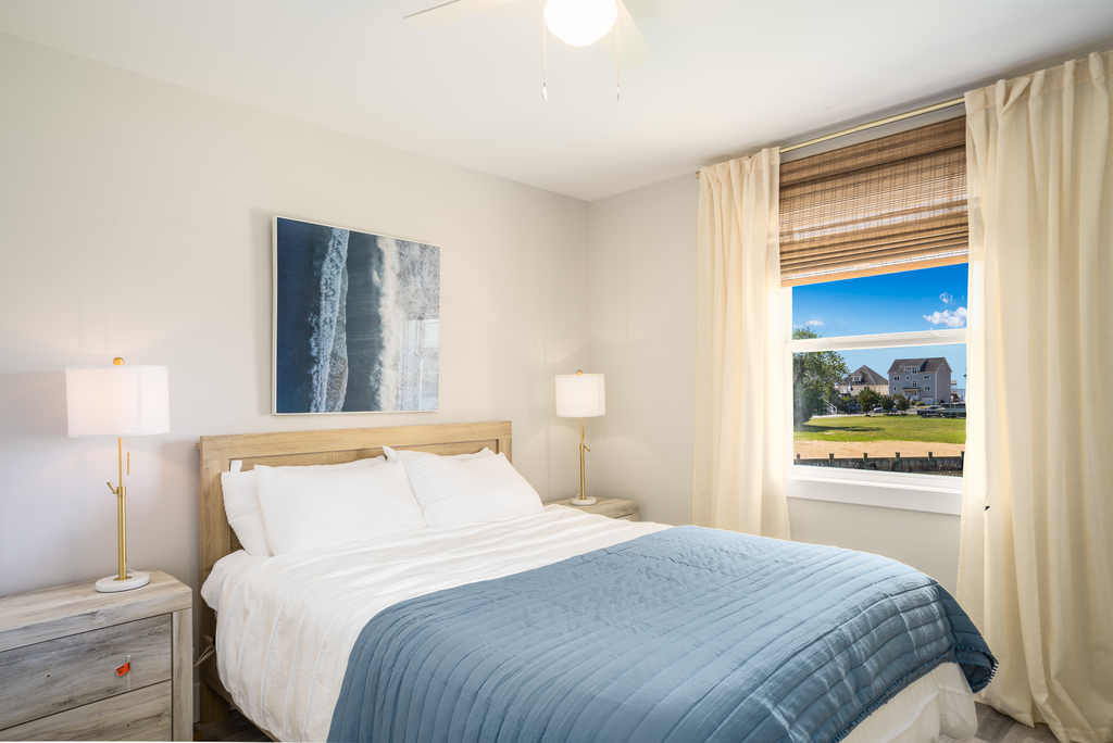 Bedroom 2 is also dressed in beachy blues and has a Queen Bed.